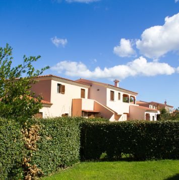 SAN TEODORO, ITALY a typical seaside Sardinian town. villas for rent homes, cute Italian street